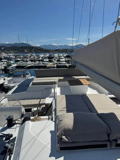 Fp Tanna 47 Yacht Photos Pics 2024 Fountaine Pajot Tanna 47 yacht with spacious deck and marina view.
