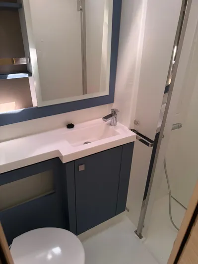 Fp Tanna 47 Yacht Photos Pics 2024 Fountaine Pajot Tanna 47 yacht bathroom with modern fixtures and sleek design.