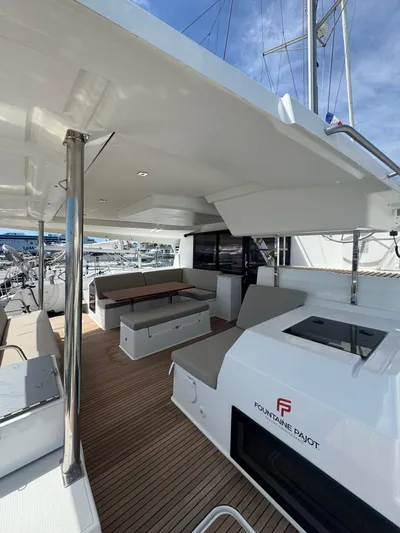 Fp Tanna 47 Yacht Photos Pics 2024 Fountaine Pajot Tanna 47 yacht deck with seating and sleek design.