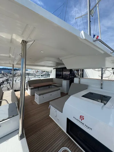 Fp Tanna 47 Yacht Photos Pics 2024 Fountaine Pajot Tanna 47 yacht with spacious deck and modern seating area.