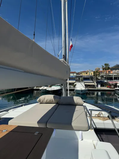 Fp Tanna 47 Yacht Photos Pics 2024 Fountaine Pajot Tanna 47 catamaran docked in a sunny marina.