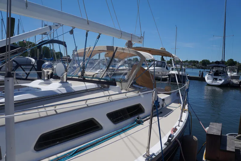 Midnight Yacht Photos Pics 2005 Sabre 386 sailboat docked at marina under clear blue sky.