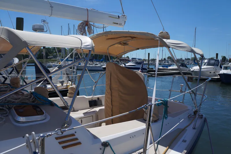Midnight Yacht Photos Pics 2005 Sabre 386 sailboat docked in a marina under clear blue skies.