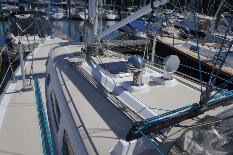 Midnight Yacht Photos Pics 2005 Sabre 386 sailboat deck with rigging and marina background.