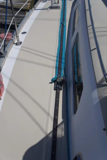 Midnight Yacht Photos Pics 2005 Sabre 386 sailboat deck with blue rigging and windows.