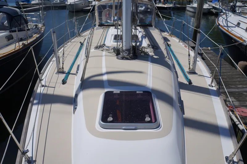 Midnight Yacht Photos Pics 2005 Sabre 386 sailboat deck view at marina, showcasing rigging and hatch.