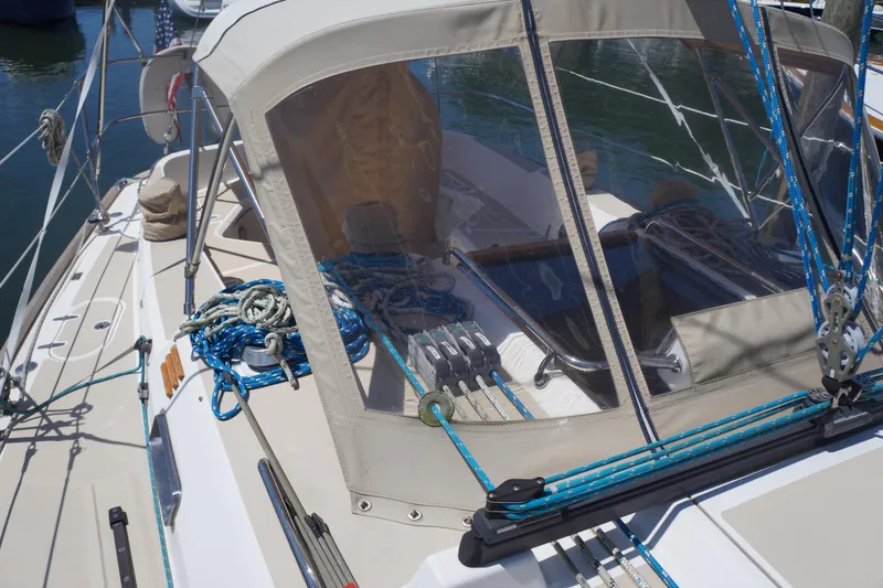 Midnight Yacht Photos Pics 2005 Sabre 386 sailboat cockpit with ropes and canopy in marina.