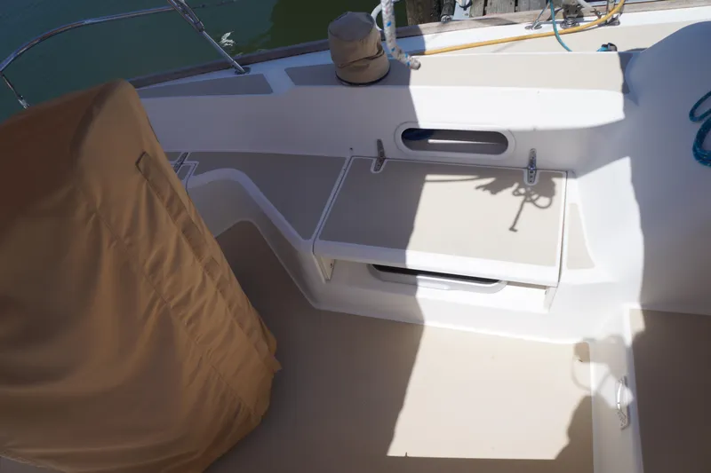 Midnight Yacht Photos Pics 2005 Sabre 386 yacht deck with covered seating and storage compartments.