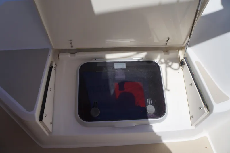 Midnight Yacht Photos Pics Open hatch on a 2005 Sabre 386 boat, showing storage compartment.