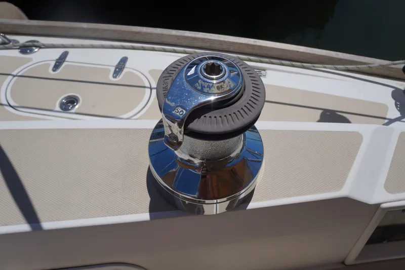 Midnight Yacht Photos Pics Winch on 2005 Sabre 386 sailboat deck, featuring polished chrome and beige accents.