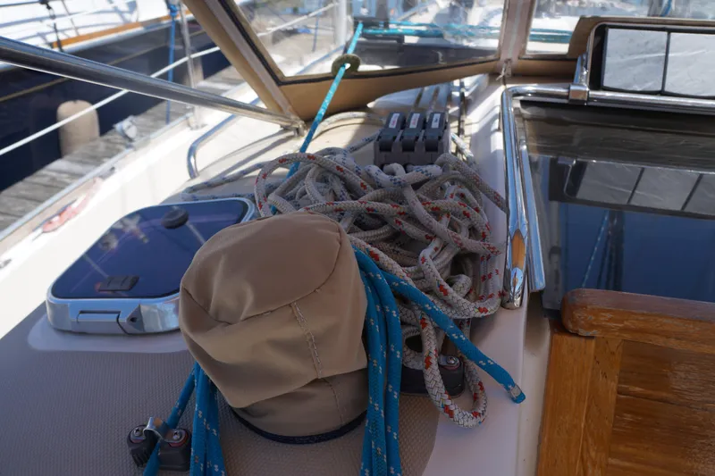 Midnight Yacht Photos Pics Deck of 2005 Sabre 386 sailboat with ropes and winch cover.