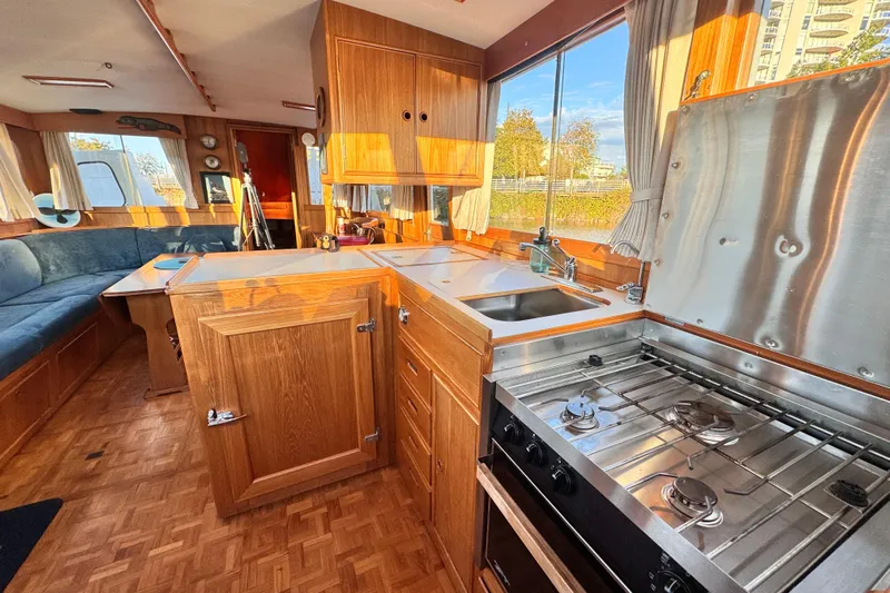  Yacht Photos Pics Interior of 1989 Grand Banks 42 yacht with kitchen and seating area.