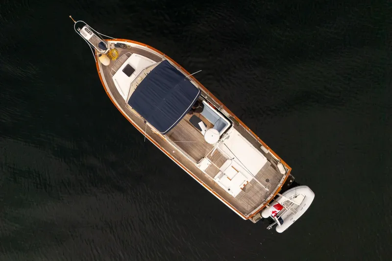  Yacht Photos Pics Aerial view of 1989 Grand Banks 42 yacht on calm water.