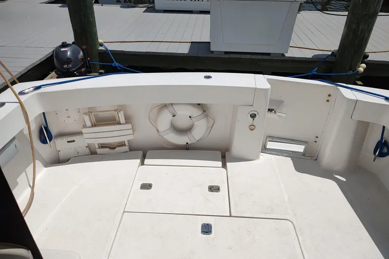 "rosebud" Yacht Photos Pics 2003 Mainship 34 PILOT boat deck with life preserver and storage compartments.