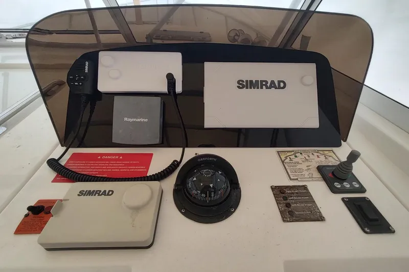 "rosebud" Yacht Photos Pics Control panel of a 2003 Mainship 34 PILOT boat with navigation equipment.