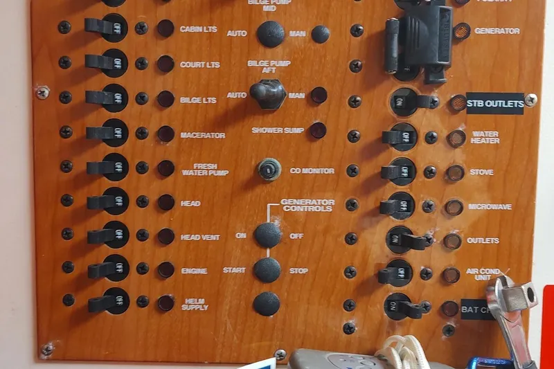 "rosebud" Yacht Photos Pics Control panel of a 2003 Mainship 34 PILOT boat with labeled switches and controls.