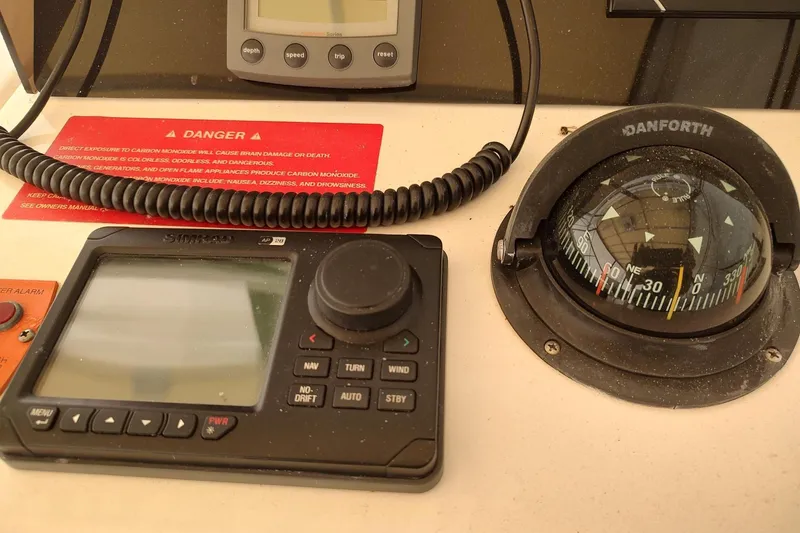 "rosebud" Yacht Photos Pics Control panel of a 2003 Mainship 34 PILOT with compass and navigation system.