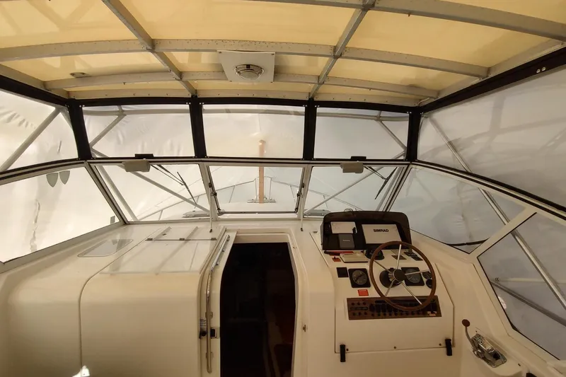 "rosebud" Yacht Photos Pics 2003 Mainship 34 PILOT boat interior with steering wheel and navigation equipment.