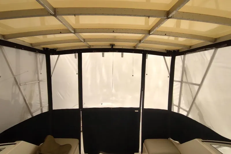 "rosebud" Yacht Photos Pics 2003 Mainship 34 PILOT boat interior with canopy and seating area.