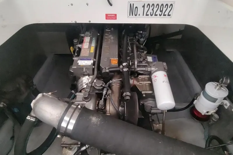 "rosebud" Yacht Photos Pics Engine compartment of 2003 Mainship 34 PILOT boat, showcasing mechanical components.