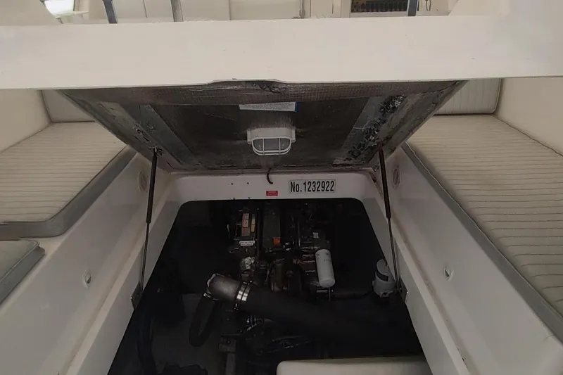 "rosebud" Yacht Photos Pics 2003 Mainship 34 PILOT engine compartment with open hatch and visible engine components.