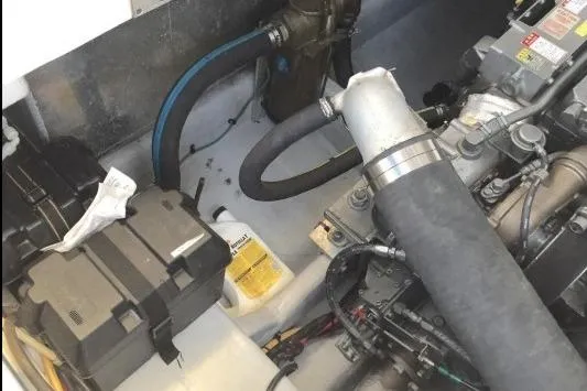 "rosebud" Yacht Photos Pics Engine compartment of a 2003 Mainship 34 PILOT boat, showing hoses and components.