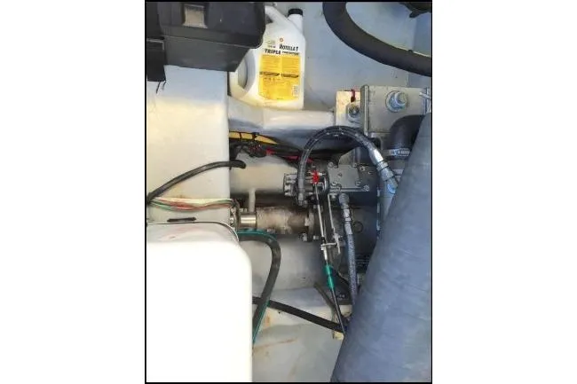 "rosebud" Yacht Photos Pics Engine compartment of a 2003 Mainship 34 PILOT with visible mechanical components.