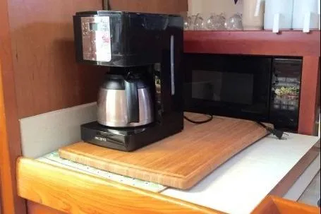 "rosebud" Yacht Photos Pics Coffee maker and microwave on Mainship 34 Pilot 2003 boat kitchen counter.