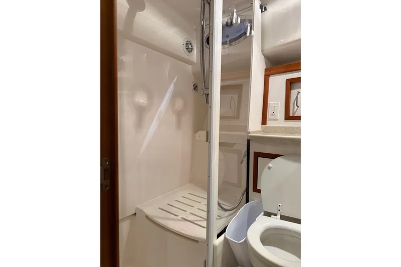 La Dolce Vita Yacht Photos Pics Bathroom interior of 2011 Back Cove 37 yacht with shower and toilet.