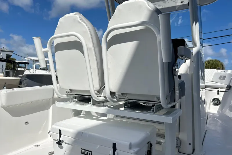  Yacht Photos Pics 2026 Sea Fox 268 Commander boat interior with white seating and Yeti cooler.
