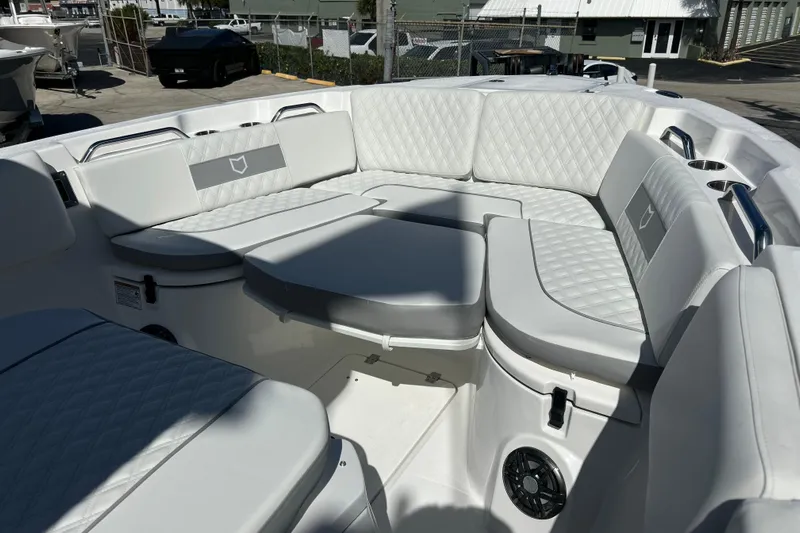  Yacht Photos Pics Luxurious seating area on 2026 Sea Fox 268 Commander boat, featuring quilted upholstery.