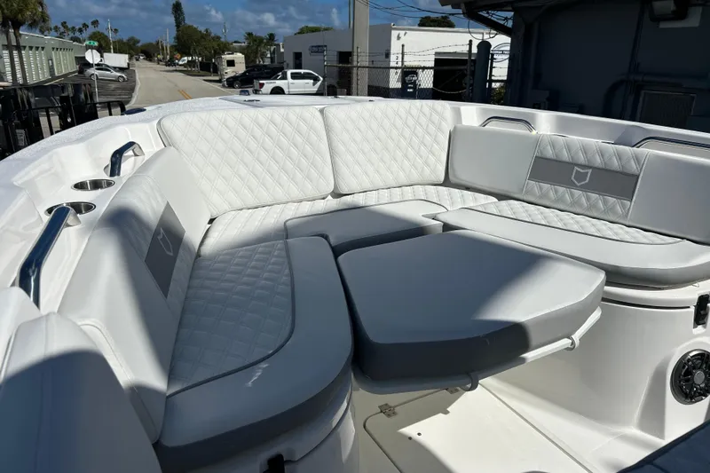  Yacht Photos Pics 2026 Sea Fox 268 Commander boat interior with luxurious white seating and cup holders.