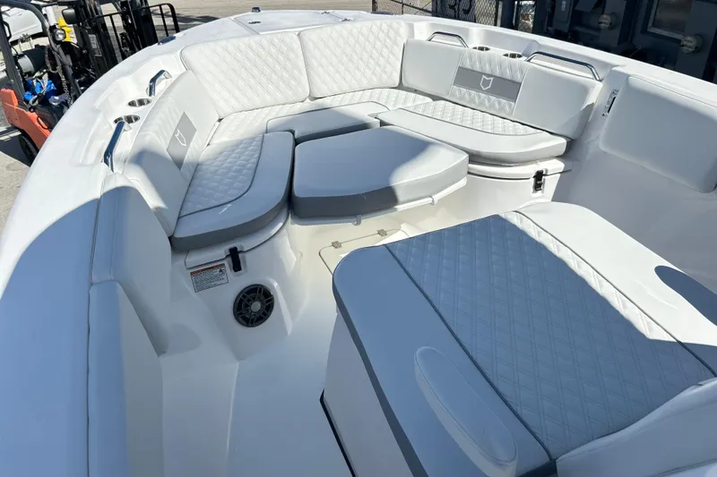  Yacht Photos Pics 2026 Sea Fox 268 Commander boat interior with cushioned seating and cup holders.