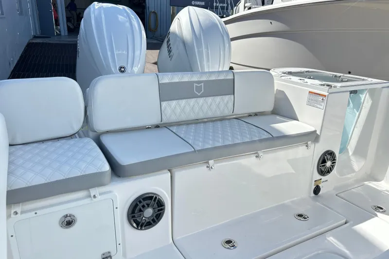  Yacht Photos Pics 2026 Sea Fox 268 Commander boat interior with cushioned seating and dual Yamaha engines.