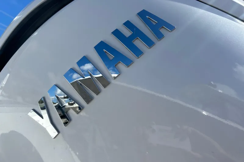  Yacht Photos Pics Yamaha logo on 2026 Sea Fox 268 Commander boat, reflecting blue sky and clouds.