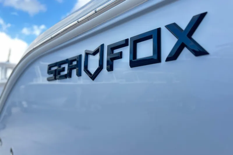  Yacht Photos Pics 2026 Sea Fox 268 Commander boat logo against a clear blue sky.