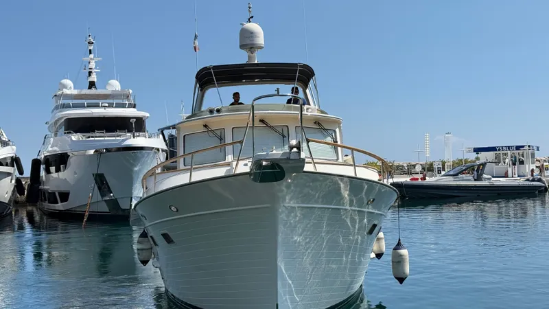 Ballade Yacht Photos Pics 2009 Fleming 55 yacht docked in marina, front view with clear blue sky.