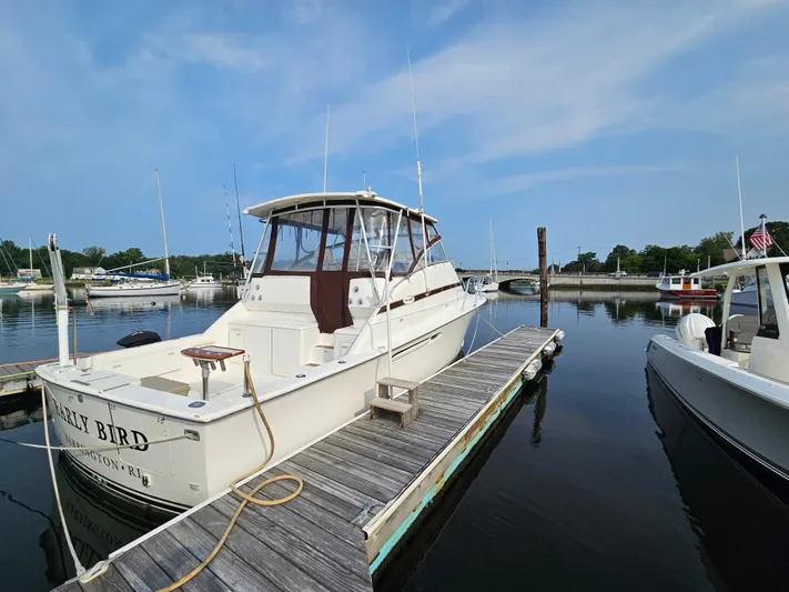 Early Bird Yacht Photos Pics 1998 Ocean Yachts 40 docked at marina under clear blue sky.
