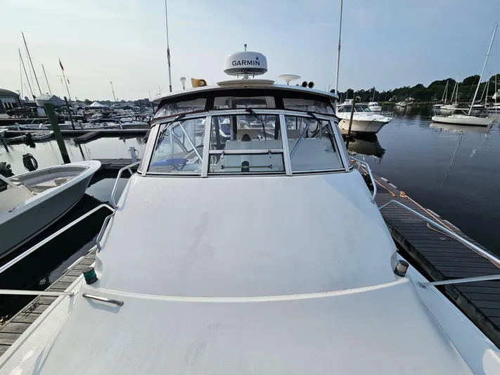 Early Bird Yacht Photos Pics 1998 Ocean Yachts 40 docked at a marina, featuring Garmin equipment.