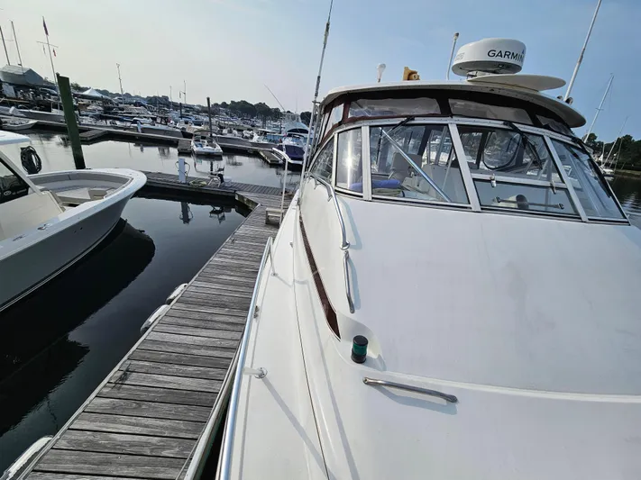Early Bird Yacht Photos Pics 1998 Ocean Yachts 40 docked at a marina, featuring sleek design and Garmin equipment.