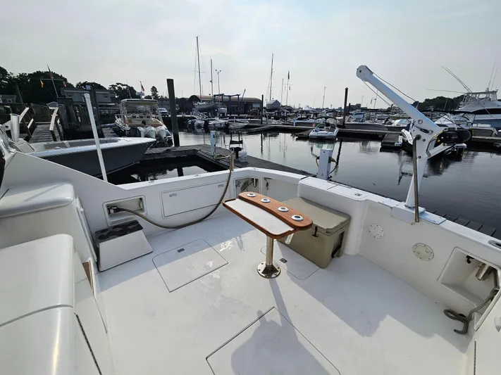 Early Bird Yacht Photos Pics 1998 Ocean Yachts 40 docked at marina, featuring spacious deck and fishing equipment.