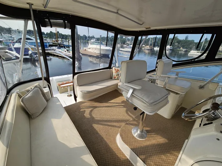Early Bird Yacht Photos Pics Spacious interior of 1998 Ocean Yachts 40, featuring comfortable seating and marina view.