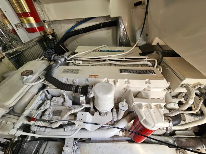 Early Bird Yacht Photos Pics Engine room of a 1998 Ocean Yachts 40, featuring a well-maintained marine engine.