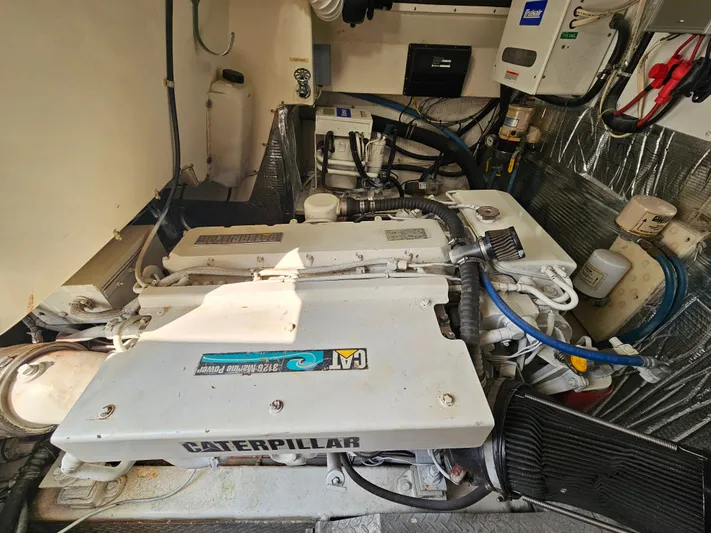 Early Bird Yacht Photos Pics Engine room of a 1998 Ocean Yachts 40, featuring Caterpillar engines.