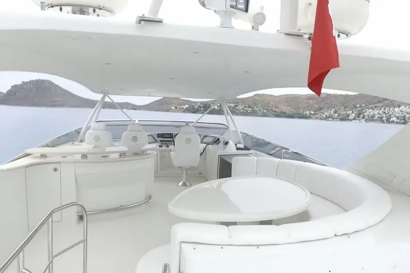  Yacht Photos Pics Luxurious 2008 Marquis 690 Fly yacht interior with elegant seating and scenic ocean view.