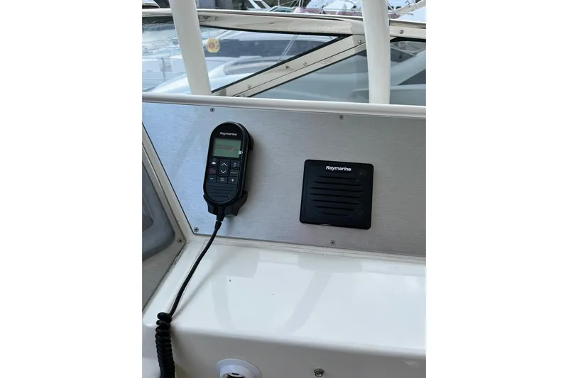  Yacht Photos Pics Raymarine marine radio and speaker on 2008 Marquis 690 Fly yacht dashboard.