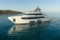 Luxury yacht Custom Line Navetta 33, 2020 model, anchored in serene blue waters.