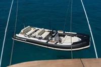 Luxury Williams tender boat on clear blue water, viewed from Custom Line Navetta 33 yacht.