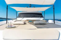 Luxurious 2020 Custom Line Navetta 33 yacht deck with sunbeds and canopy.