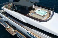Luxurious 2020 Custom Line Navetta 33 yacht with jacuzzi on deck, cruising in open sea.